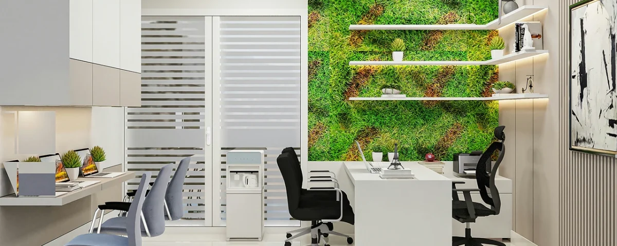 Ufficio moderno con parete verde decorata e opere d'arte alle pareti